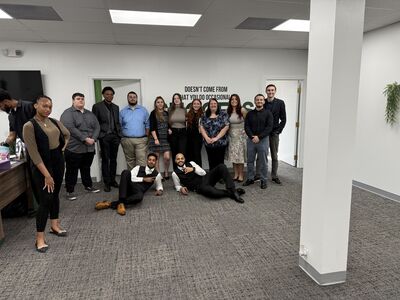 The full team smiling together